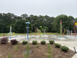 Kids cooling off at White Deer Park Splash Pad in Garner